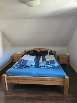 Ein Bett oder Betten in einem Zimmer der Unterkunft Das Alte Kneipchen