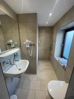 Ein Badezimmer in der Unterkunft Gasthaus Sonnen