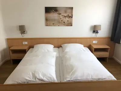 Ein Bett oder Betten in einem Zimmer der Unterkunft Gasthaus Sonnen