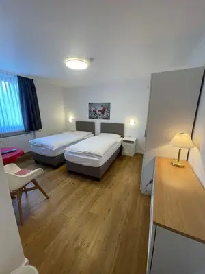 Ein Bett oder Betten in einem Zimmer der Unterkunft Gasthaus Sonnen