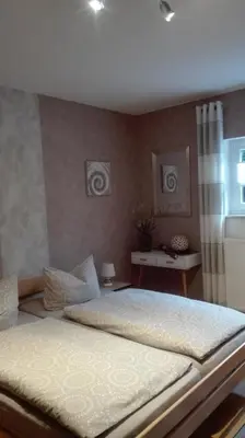 Ein Bett oder Betten in einem Zimmer der Unterkunft Zimmer Schmitz