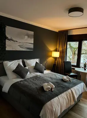Ein Bett oder Betten in einem Zimmer der Unterkunft Rheinpanorama Suite mit Balkon