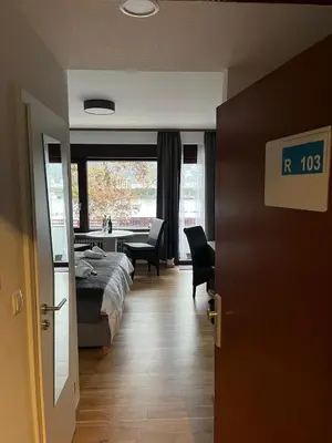 Ein Bett oder Betten in einem Zimmer der Unterkunft Rheinpanorama Suite mit Balkon