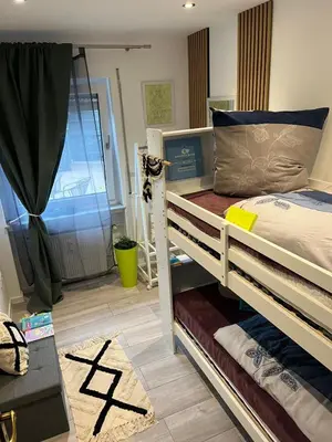 Ein Bett oder Betten in einem Zimmer der Unterkunft Ferienwohnung Mobembo