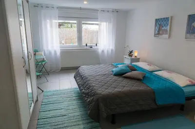Ein Bett oder Betten in einem Zimmer der Unterkunft Tante Lollo