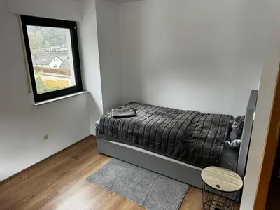 Ein Bett oder Betten in einem Zimmer der Unterkunft Malerisch im Tal der Loreley