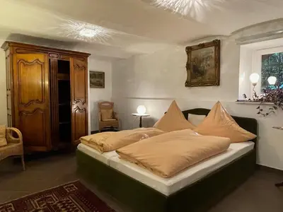 Ein Bett oder Betten in einem Zimmer der Unterkunft Ferienwohnung der besonderen Art in Villa am Glan