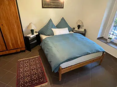 Ein Bett oder Betten in einem Zimmer der Unterkunft Ferienwohnung der besonderen Art in Villa am Glan