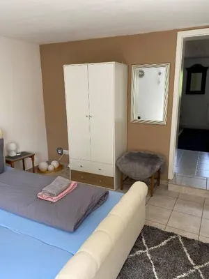 Ein Bett oder Betten in einem Zimmer der Unterkunft Ferienwohnung Eschbach Hof 2 am Nürburgring