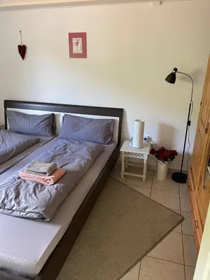 Ein Bett oder Betten in einem Zimmer der Unterkunft Ferienwohnung Eschbach Hof 2 am Nürburgring