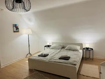 Ein Bett oder Betten in einem Zimmer der Unterkunft Familien Ferienhaus in der Vulkaneifel -Mechthild-