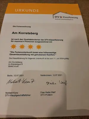 Ein Zertifikat, Auszeichnung, Logo oder anderes Dokument, das in der Unterkunft Ferienwohnung Am Korretsberg ausgestellt ist