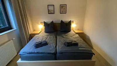 Ein Bett oder Betten in einem Zimmer der Unterkunft Fewo Taunusblick mit Pool