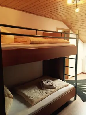 Ein Bett oder Betten in einem Zimmer der Unterkunft Meisenthaler Mühle