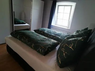 Ein Bett oder Betten in einem Zimmer der Unterkunft Idyllische Ferienwohnung nahe Nürburgring