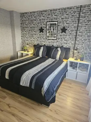 Ein Bett oder Betten in einem Zimmer der Unterkunft Hakans moselblick Ferienwohnung 2
