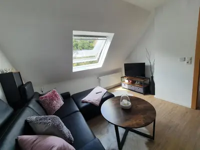 Ein Sitzbereich in der Unterkunft Gästehaus Burgberg, Weinhaus Fries