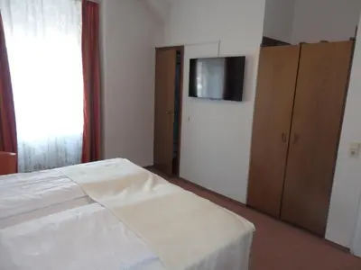 Ein Bett oder Betten in einem Zimmer der Unterkunft Hotel Rheinischer Hof