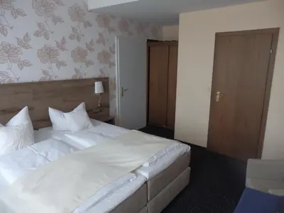 Ein Bett oder Betten in einem Zimmer der Unterkunft Hotel Rheinischer Hof