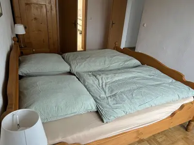 Ein Bett oder Betten in einem Zimmer der Unterkunft Ferienwohnung Baumann