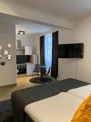 Ein Bett oder Betten in einem Zimmer der Unterkunft City Apartments Trier Suite 3