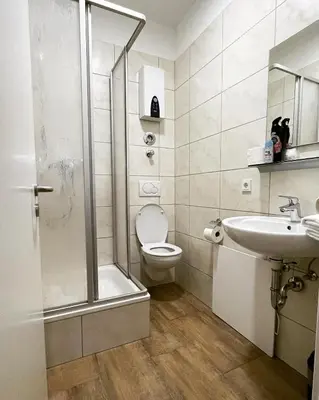 Ein Badezimmer in der Unterkunft City Apartments Trier Suite 5