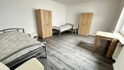 Ein Bett oder Betten in einem Zimmer der Unterkunft KomfortKoblenz WE17