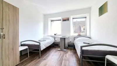 Ein Bett oder Betten in einem Zimmer der Unterkunft StadtRaum mit 3 Zimmer am Rhein WE5
