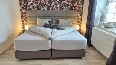 Ein Bett oder Betten in einem Zimmer der Unterkunft Eifelauszeit - Wohnung Klein