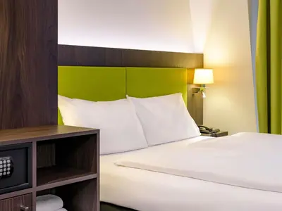 Ein Bett oder Betten in einem Zimmer der Unterkunft Ibis Styles Trier