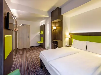 Ein Bett oder Betten in einem Zimmer der Unterkunft Ibis Styles Trier