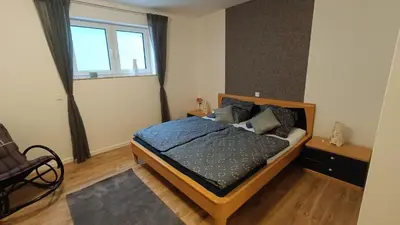 Ein Bett oder Betten in einem Zimmer der Unterkunft Ferienwohnung Zum Kreuzbaum