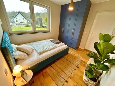 Ein Bett oder Betten in einem Zimmer der Unterkunft Ron vacation home in Gerolstein