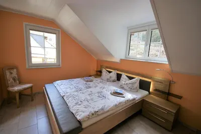 Ein Bett oder Betten in einem Zimmer der Unterkunft Beilsteiner Ferienwohnungen