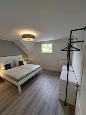 Ein Bett oder Betten in einem Zimmer der Unterkunft FeWo's Weinbergblick Wintrich by Brauneberger Hof an der Mosel