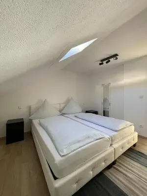 Ein Bett oder Betten in einem Zimmer der Unterkunft Ferienhaus - Eifeltraum - Salm