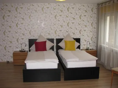 Ein Bett oder Betten in einem Zimmer der Unterkunft Kräuterhotel Villa Vontenie