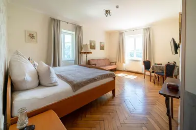 Ein Bett oder Betten in einem Zimmer der Unterkunft Kräuterhotel Villa Vontenie