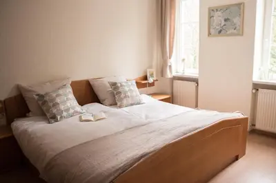 Ein Bett oder Betten in einem Zimmer der Unterkunft Kräuterhotel Villa Vontenie