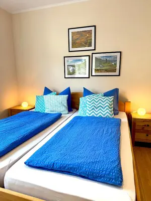 Ein Bett oder Betten in einem Zimmer der Unterkunft Burggarten Wine Residences - Wein direkt vom Winzer, eBike & eAuto aufladen und parken