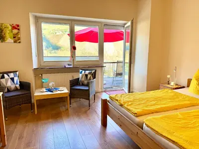 Ein Bett oder Betten in einem Zimmer der Unterkunft Burggarten Wine Residences - Wein direkt vom Winzer, eBike & eAuto aufladen und parken