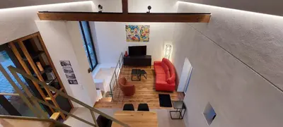 Ein Sitzbereich in der Unterkunft Scheune als besonderes Ferienhaus in der Südeifel - SCHEIA