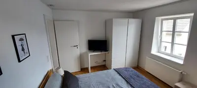 Ein Bett oder Betten in einem Zimmer der Unterkunft Denkmalgeschütztes Ferienhaus in der Südeifel - Ferienhaus HAZEN