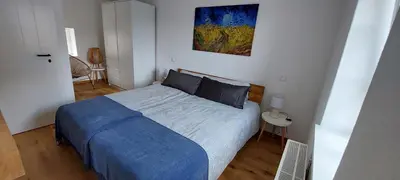 Ein Bett oder Betten in einem Zimmer der Unterkunft Denkmalgeschütztes Ferienhaus in der Südeifel - Ferienhaus HAZEN