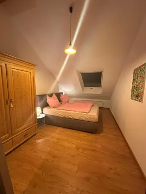 Ein Bett oder Betten in einem Zimmer der Unterkunft Ferienwohnung LESOM
