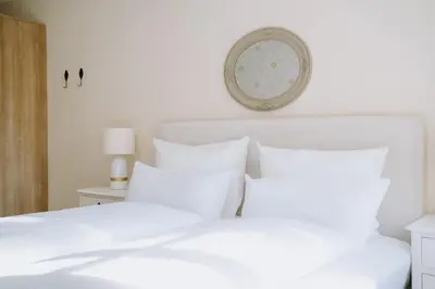 Ein Bett oder Betten in einem Zimmer der Unterkunft KAROLINGERHOF - Mosel