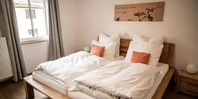 Ein Bett oder Betten in einem Zimmer der Unterkunft Weingut Marx - Rotes Haus