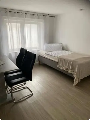 Ein Bett oder Betten in einem Zimmer der Unterkunft Ferienwohnung 2 in direkter Nähe zum Rhein