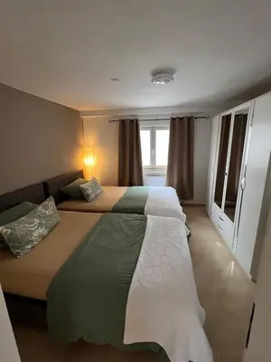 Ein Bett oder Betten in einem Zimmer der Unterkunft Ferienwohnung 5 in direkter Nähe zum Rhein