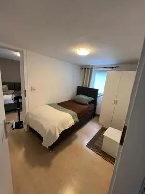 Ein Bett oder Betten in einem Zimmer der Unterkunft Ferienwohnung 5 in direkter Nähe zum Rhein